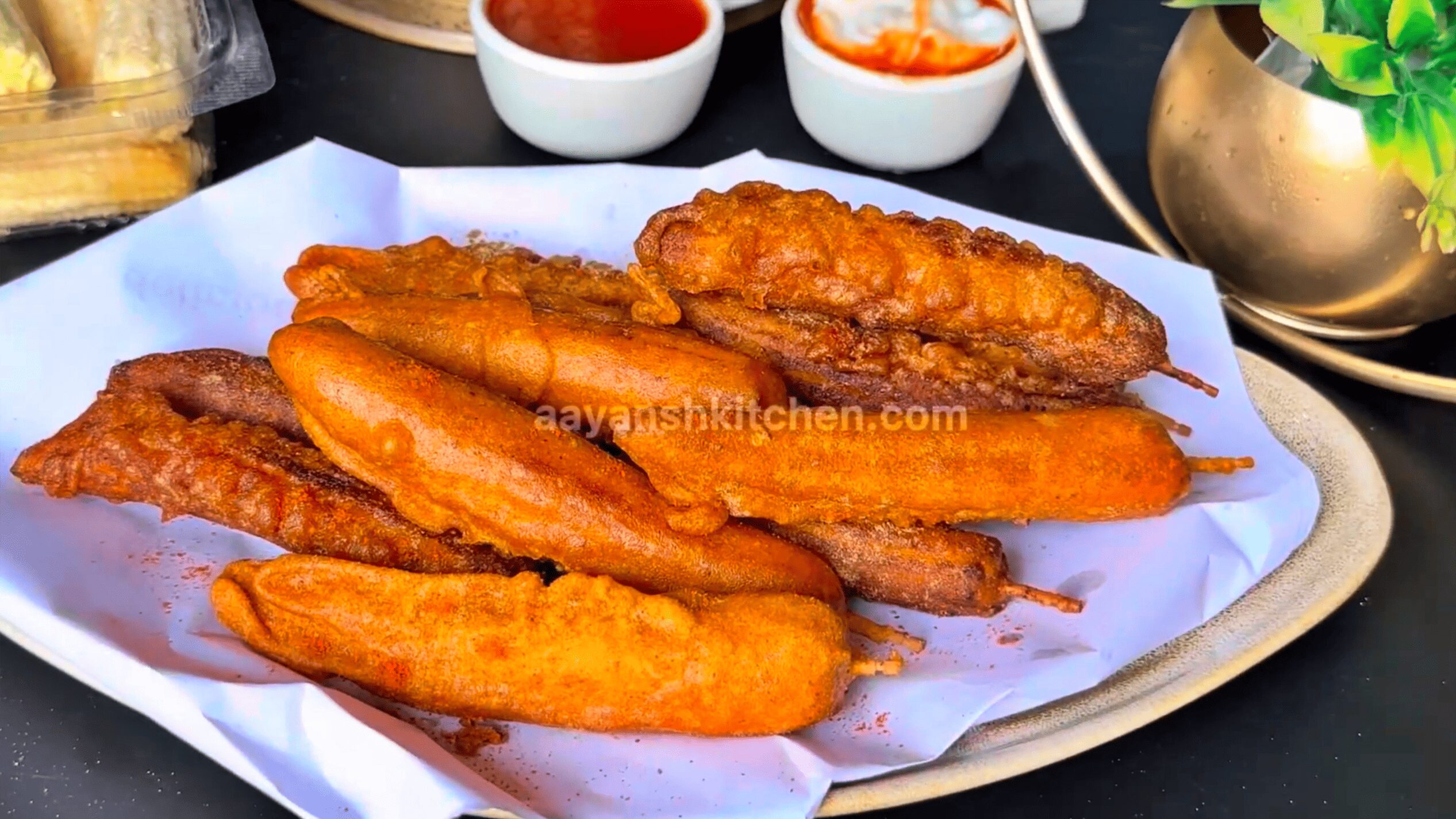 Baby corn fry on a plate sprinkled with Chaat Masala and Red Chilli Powder