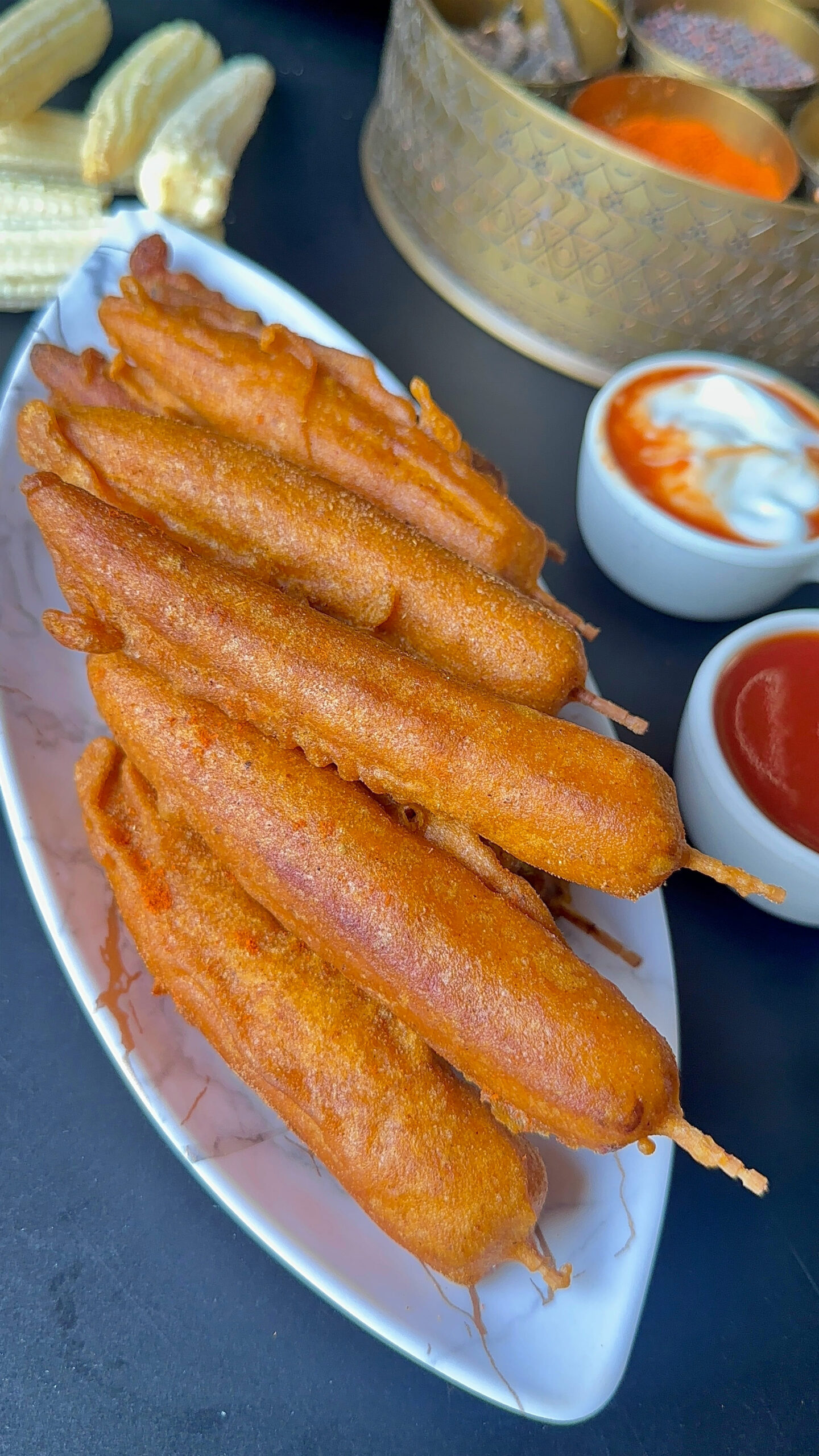 Baby Corn Fritters on a plate with Ketchup